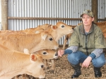 Katie Milne tending to calves on her West Coast farm.