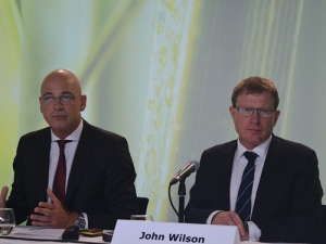 Fonterra chief executive Theo Spierings makes a point to journalists while chairman John Wilson looks on.