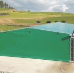 Tie-down tarps keep feed/fert dry