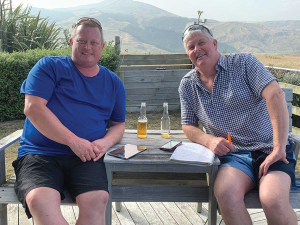 Nathan Addis and Mark Warren, with smoke haze from Aussie bush fires in the background.