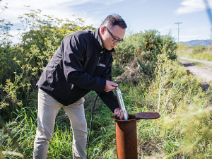 James Wang from Lincoln Agritech installing a HydroMetricsTM nitrate sensor in a monitoring well in Canterbury. SUPPLIED/Lincoln Agritech