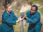 Dr Rene Corner-Thomas and PhD student Aloyce Bunyaga set up a camera.