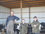 Farm staff Andrew Pike and Campbell and Lachie Bassett feed calves.