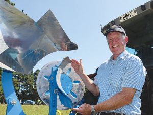 Professor Mike Hedley with the plough that creates full inversion tillage.