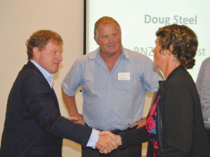 John Wilson meets AgFirst’s Kim Robinson (right) while attending a Northland Dairy Development Trust conference in Whangarei earlier this month.