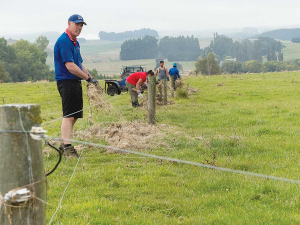 Darren Jack, St Peter’s College deputy principal and his students help in the clean-up.