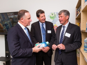 Prime Minister John Key looks at packaging with Chris Morgan (Tetra Pak Market Area Leader NZ) and Tim High (Tetra Pak Vice President) at the opening of the Tetra Pak office at Waikato Innovation Park, Hamilton, Thursday 7 April 2016. Photo: Stephen Barker/Barker Photography. 