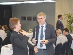 OSPRI NZ’s Stu Hutchings (right)  and farmer Raewyn van Gool discuss TB issues at the Primary Industries Summit.