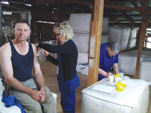 Covid-19 vaccinator Leanne Allnutt administers a jab to Roddy Brown of Blue Mountain Station on a recent visit to the Mackenzie County station by a team from the South Canterbury DHB last month.