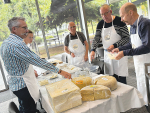 Master Judge Jason Tarrant (left) guiding some of the judges through an evaluation of 253 NZ-made cheeses at Wintec in Hamilton recently.