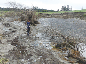 Lisa Milligan in a gully scoured out of the farm, which she and her mother Karen have only recently taken over.