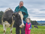 Ray Dickie and granddaughter Cassie with cow Glenstuart Unix Dolly VG88.