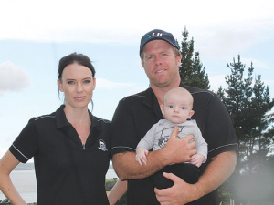 Dan and Gina Duncan with 3-month old Brock on the farm.