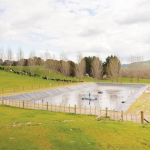 Assessors look at a farm’s effluent system before issuing a WoF.