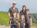 Hayden and Alecia Lawrence with their children on the farm.