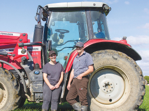 Manawatu dairy farmers Wendy and Richard Ridd with their Massey Ferguson 6713S.