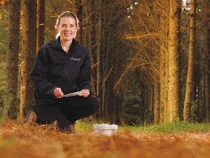 Scientist and project lead Kathryn Walker is measuring how fast soil microbes are consuming methane by taking gas samples from field chambers installed in forests.