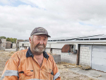 Lincoln vegetable grower Lance Roper with some of the solar panels recently installed atop many of his buildings to power his processing and coolstore plants. Photo Credit: Nigel Malthus