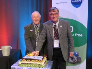 RCNZ life members Bryan Murray, Canterbury, and Colin Mackenzie cut the anniversary cake to celebrate 20 years of the association of Rural Contractors New Zealand.