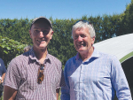 Chris Morrison (left), chair of Organic Aotearoa NZ on-orchard in Opotiki with Hon Damien O’Connor, Minister for food safety.