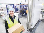 Jason Wright, Stanhope plant manager with one of the first batches of cheese made at the new plant.