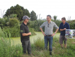 Climate Change Minister James Shaw  (centre) with farmer Aiden Bichan (left) at Kaiwaiwai Farm Wetlands, Featherston.