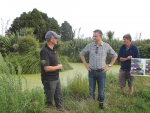 Climate Change Minister James Shaw (centre) with farmer Aiden Bichan (left) at Kaiwaiwai Farm Wetlands, Featherston.