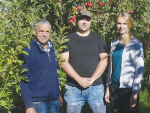 Family affair: Nick White with his son Luke and daughter Kylie on their orchard at Loburn. Photo Credit: Nigel Malthus.