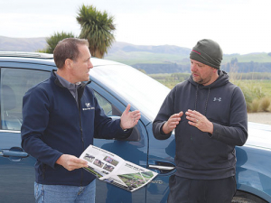 Scott Ruby (left), World Wide Sires, discusses genetics with North Otago farmer Nathan Bayne.