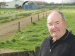 Murray Moxham’s milk shed (in background) was flooded last month.