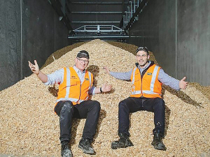 McCain Timaru engineering project manager Lenard Smythe and plant manager Jordan Jurcina with woodchips that will be used to replace coal.