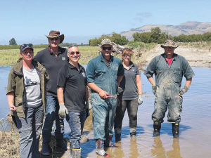 Federated Farmers executives led by president Katie Milne (left) help clean up affected farms.