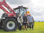 Sam Cane (centre) is pictured with his deer farming parents Kathy and Malcolm in front of their Case Puma 165.