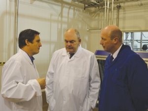 Scottie Chapman, chief executive Spring Sheep Dairy, talks with Steven Joyce and Hamilton East MP David Bennett at the new plant last week.