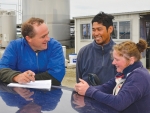 Southland farmer Matthew Richards with his team Sarah Cobb and Raymund Ramel.