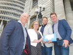 Migrant petitioners (from left) Chris Lewis, Barbara Kuriger, Ben De’Ath and Wayne Langford on the steps of Parliament with the petition.