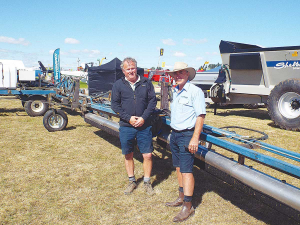 L to R: Rick Daly, Windwhistle Contracting, and Rotowiper&#039;s Dougal Lamont with the 24-metre wide weed wiper at the SIAFD at Kirwee.