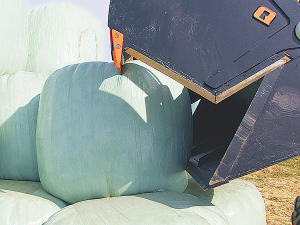 Quicke Silocut helps safely split and cut wrapped silage bales.