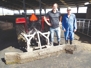 Farmer Henry Hendricks (right), with ACR Group&#039;s Richard Morgan, says the mats are easy to keep clean with a tractor scraper.