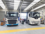 Fonterra&#039;s first electric milk tanker (right) being footed out at its Morrinsville garage.