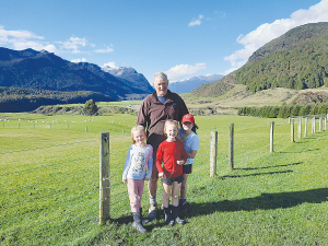 Peter Chartres, with his three daughters, Daniella (5), Lia (7) and Josephine (9) on Te Anau Downs Station.