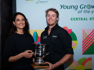 Jacob Coombridge, winner of Central Otago Young Grower, being presented with the trophy by Bernadine Guilleux.