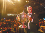 Tataiwhetu Trust chair Paki Nikora with the Ahuwhenua trophy for the top Maori dairy farm of the year award. Photo Credit: Alphapix