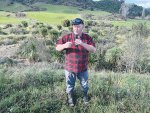 Gray Baldwin presenting to guests in front of the constructed wetland.