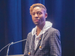 Sammy Ramsey speaks at the recent Apiculture NZ Conference in Christchurch. Photo Credit: Nigel Malthus