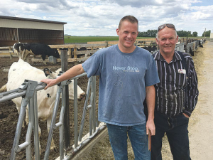 Alex Huisman and his father Adrian on their Alberta farm.