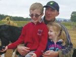 Brad Missen, Australian dairy farmer with his children, Nicholas and Zara.
