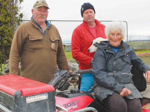 Suzanne Giesen with her boys Robbie (left) and Hamish who are called in to help out on the farm.